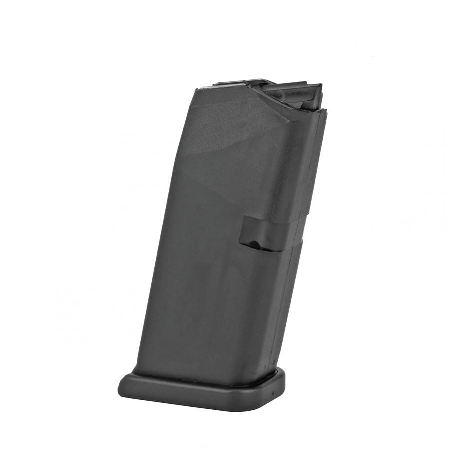 Black firearm magazine standing upright.