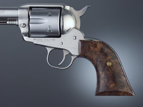 Close-up of a vintage revolver with wooden grip.