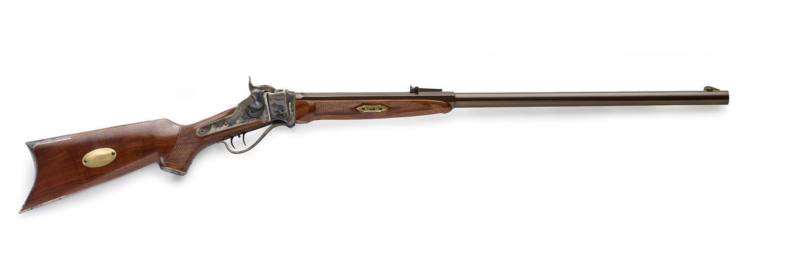 Antique rifle with wooden stock and brass accents