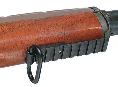 Close-up of a rifle with wooden stock
