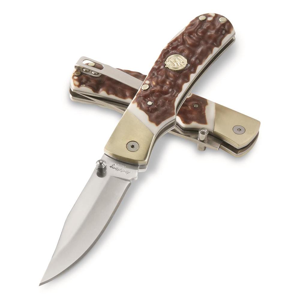 Two folding pocket knives with textured handles