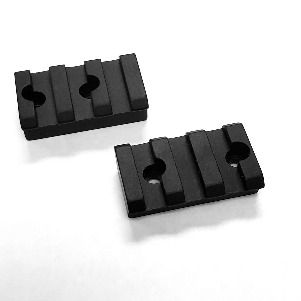 Two black metal mounting rail sections