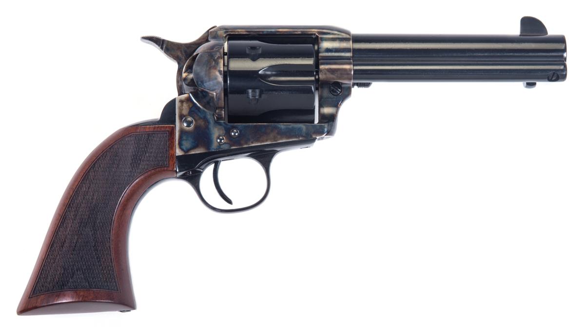 Vintage revolver with wooden grip on white background