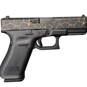 Black handgun with gold crack-pattern slide