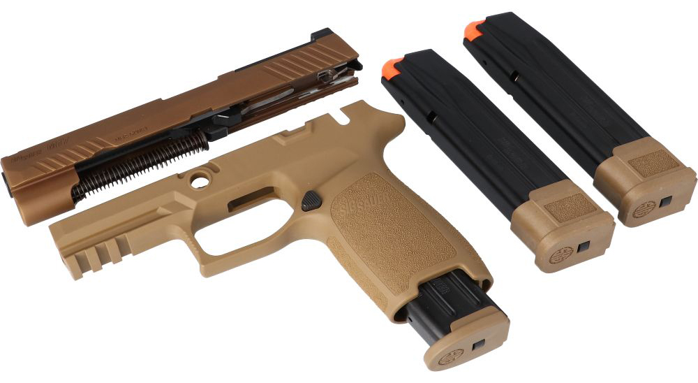 Disassembled tan and black semi-automatic pistol with magazines