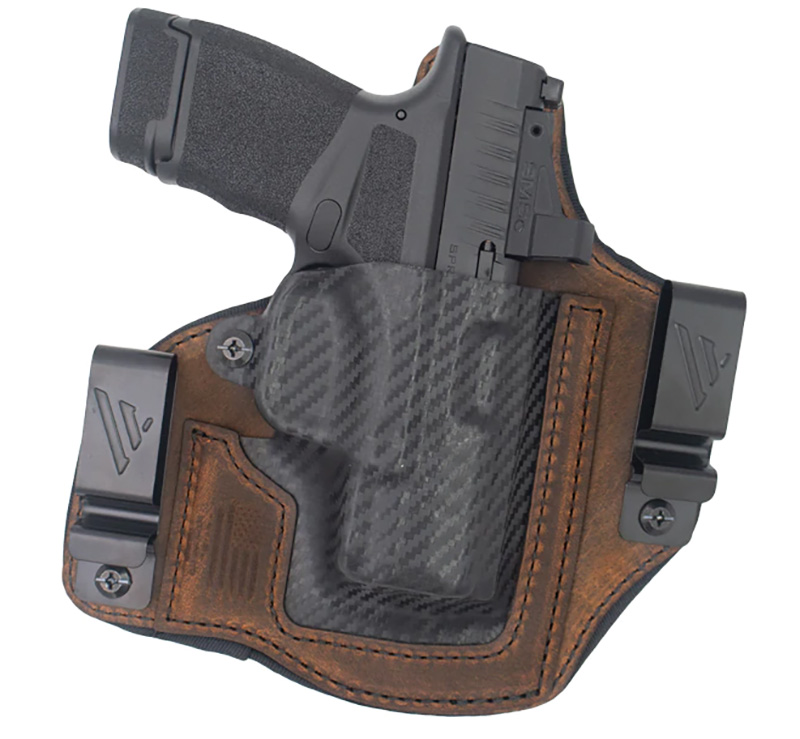 Handgun in leather and carbon fiber holster