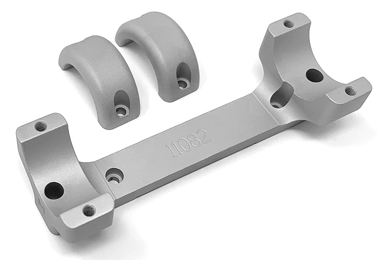 Machined aluminum bracket with two bearing caps