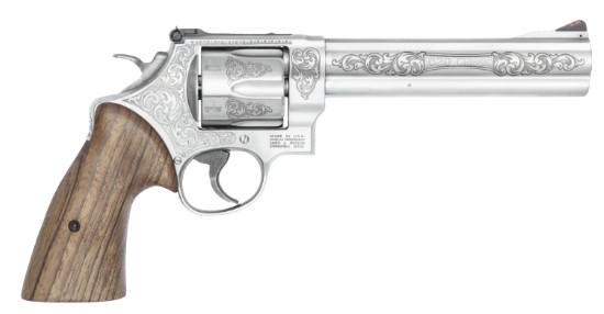 Engraved silver revolver with wooden grip