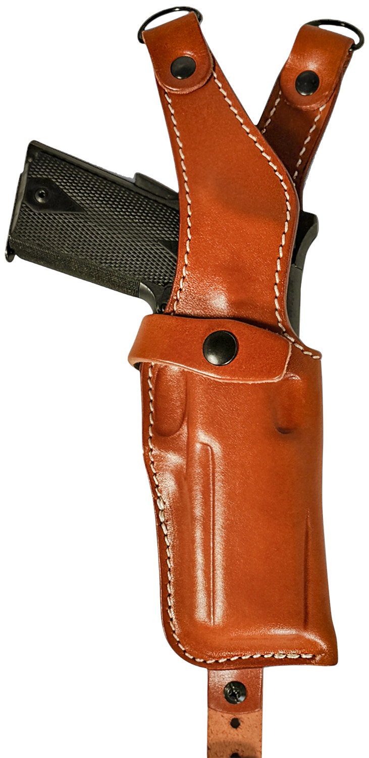 Handgun in brown leather shoulder holster