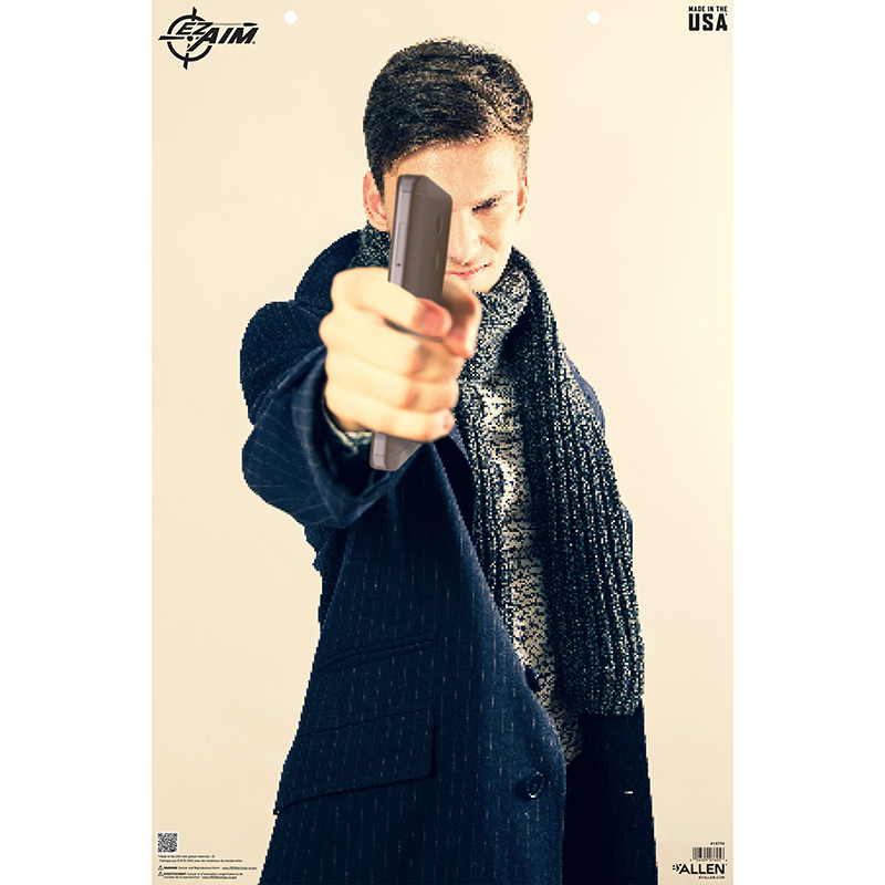 Man aiming handgun toward camera in advertisement