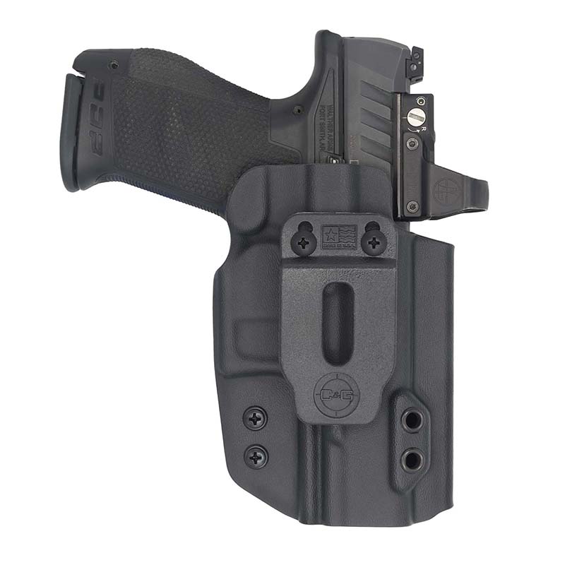 Black handgun in molded holster with optic sight