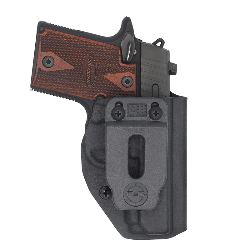 Handgun in black holster with wooden grip