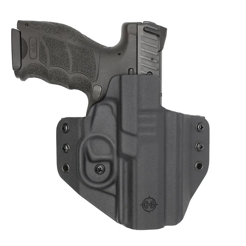 Black handgun in Kydex holster
