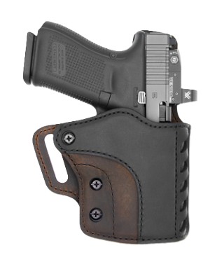Black handgun in leather holster