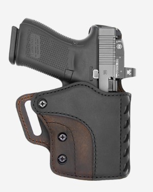 Semi-automatic pistol in leather holster