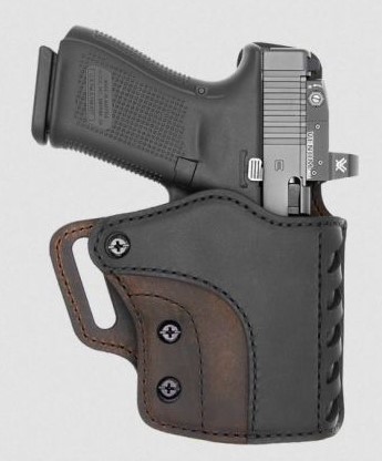 Handgun in black and brown leather holster