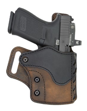 Compact handgun in brown and black leather holster