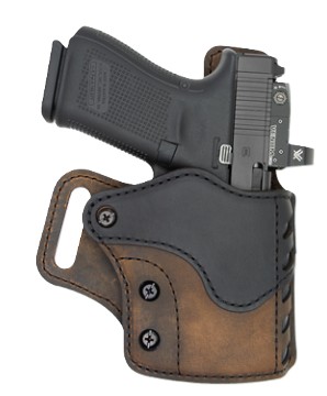 Compact handgun in brown and black leather holster