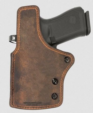 Handgun in brown leather holster