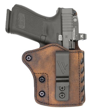 Handgun in brown leather holster