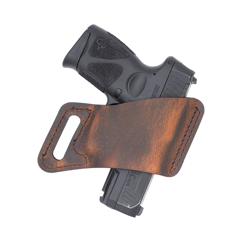 Handgun in brown leather holster