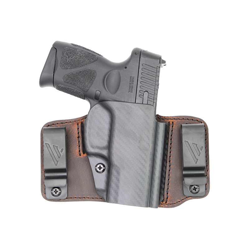 Compact handgun in leather and Kydex holster