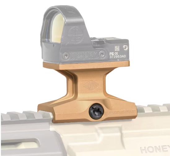 Red dot sight mounted on rifle rail