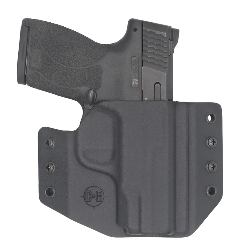Compact handgun in black Kydex holster
