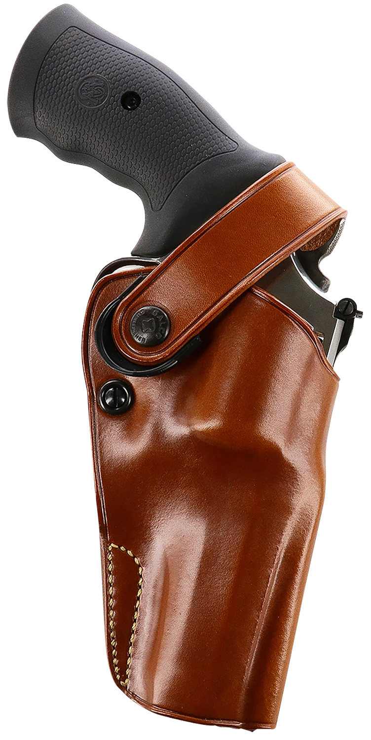 Revolver in brown leather holster