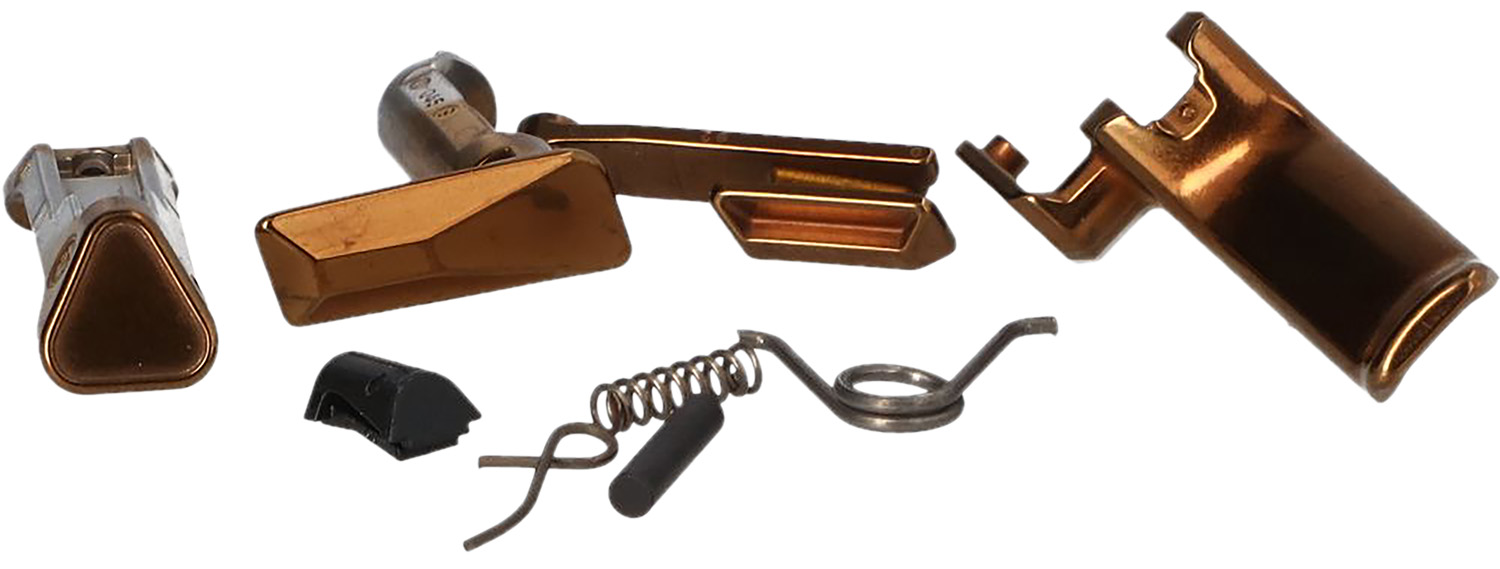 Copper-colored metal mechanical parts on white background