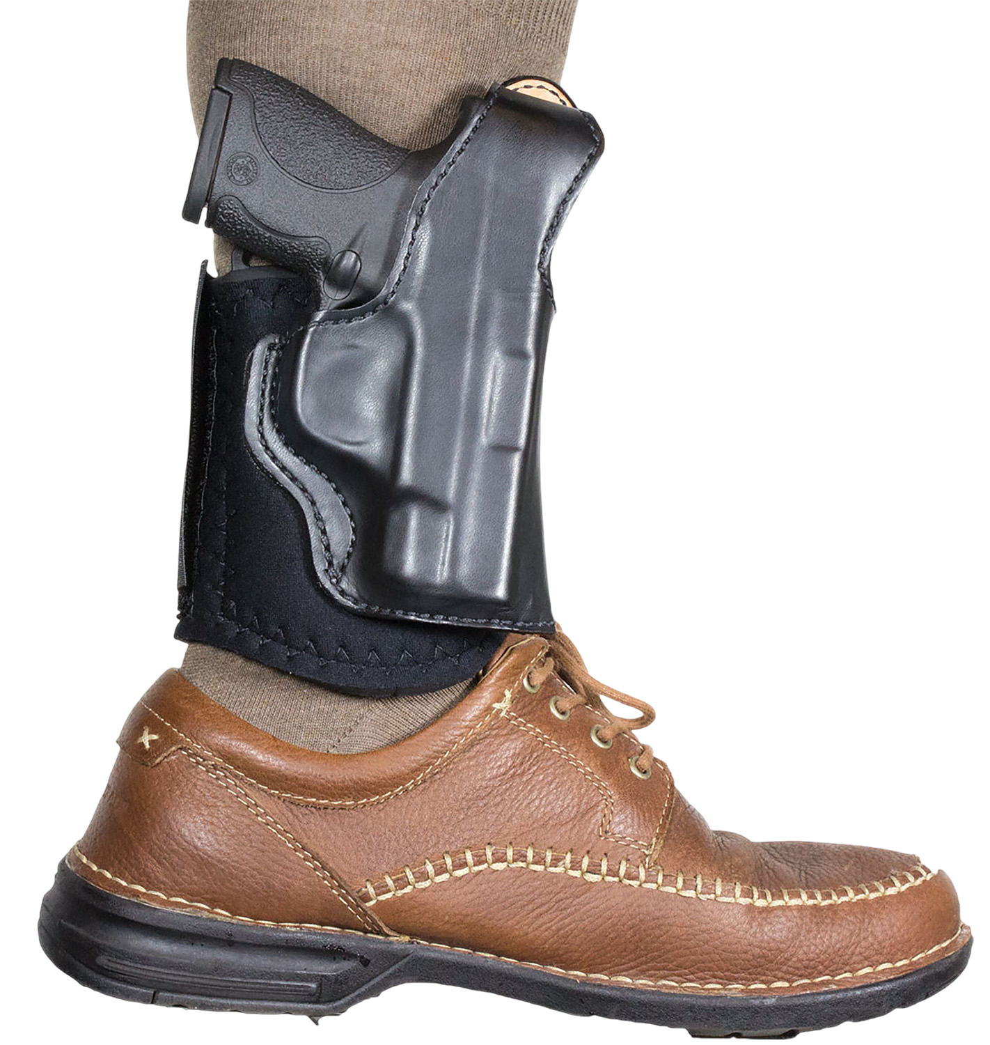 Ankle holster with concealed handgun above shoe