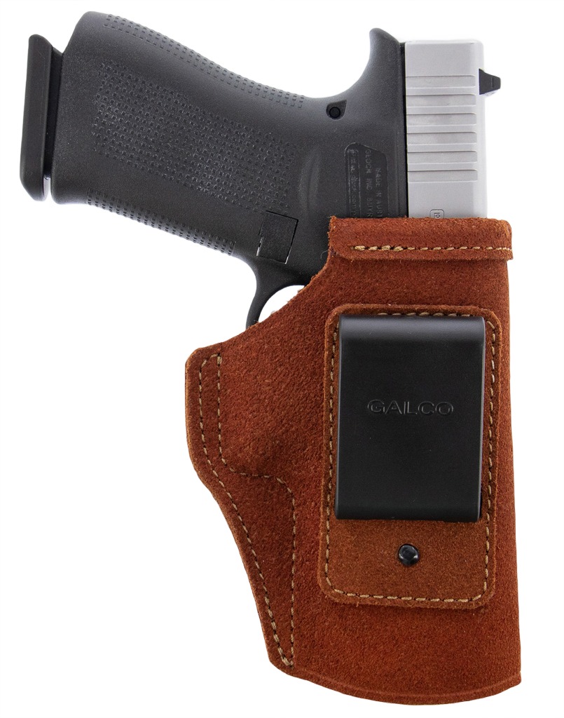 Handgun in brown suede belt holster