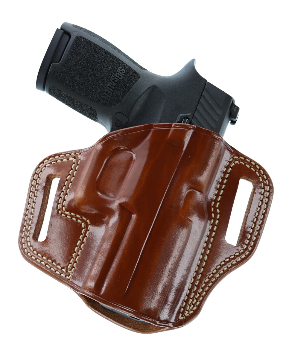 Handgun in brown leather belt holster