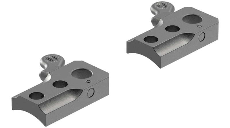 Two machined metal components with drilled holes
