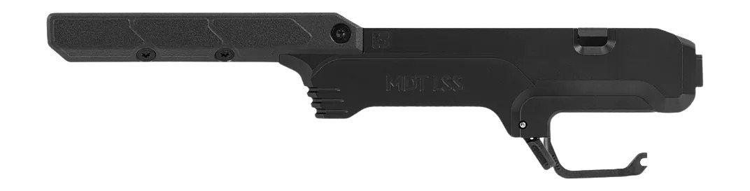 Black firearm chassis with integrated trigger guard
