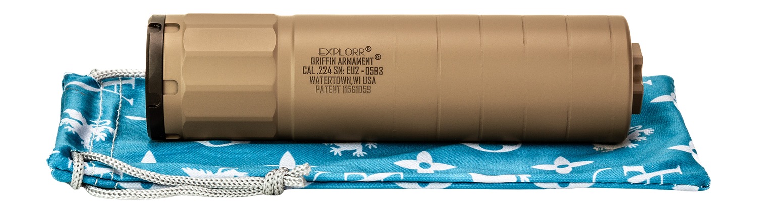 Tan firearm suppressor on blue drawstring pouch