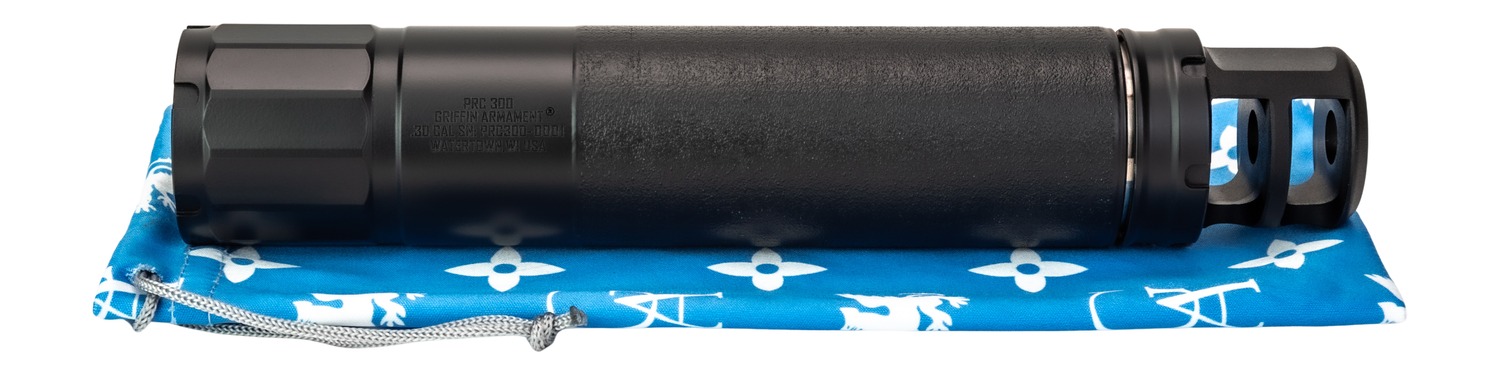 Black rifle suppressor on blue patterned cloth