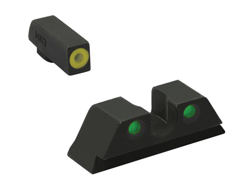 Black pistol night sights with green dots