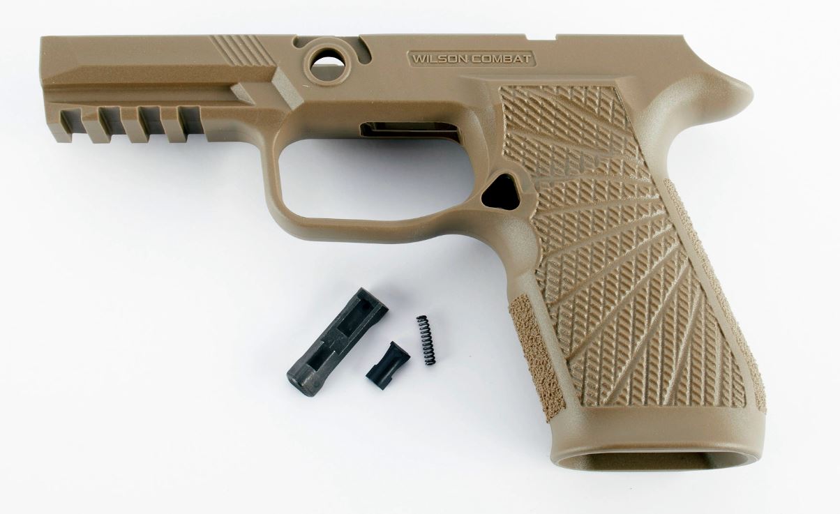 Tan handgun frame with small internal components