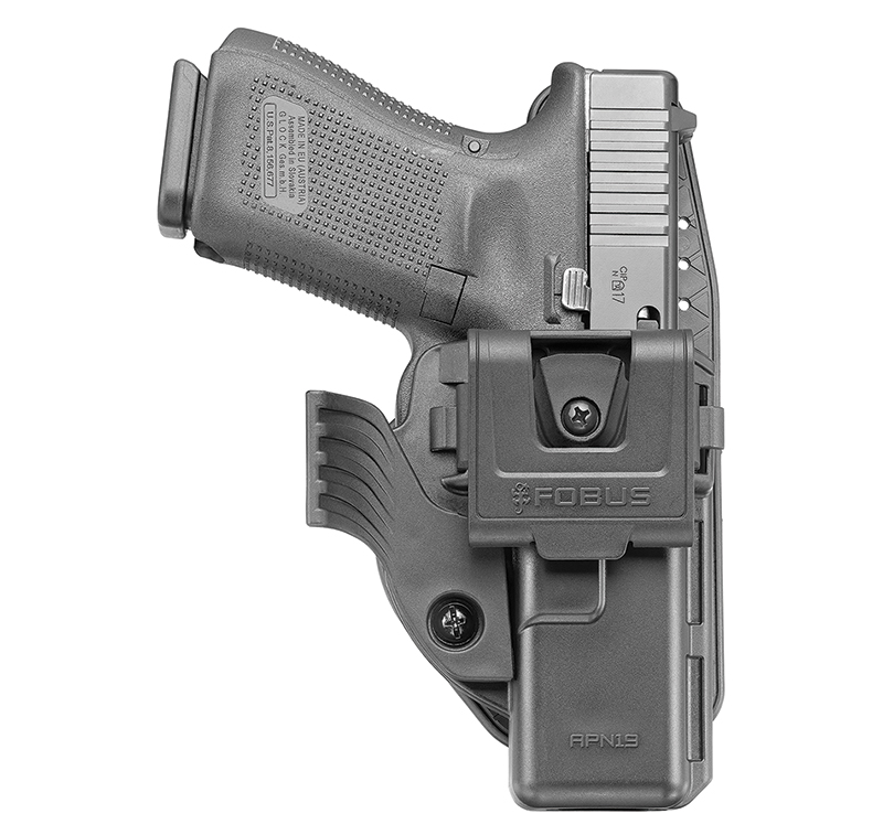 Black handgun in polymer belt holster
