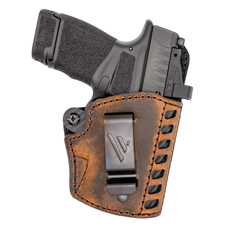 Handgun in brown leather concealed carry holster