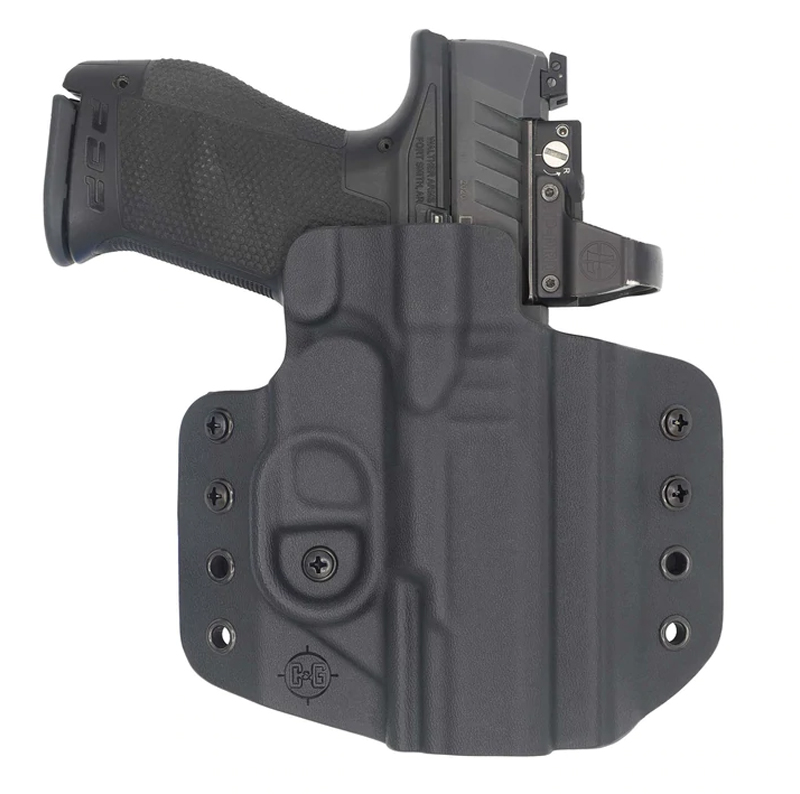 Handgun with red dot sight in holster