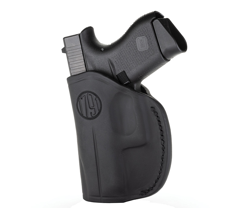 Black handgun in molded leather holster