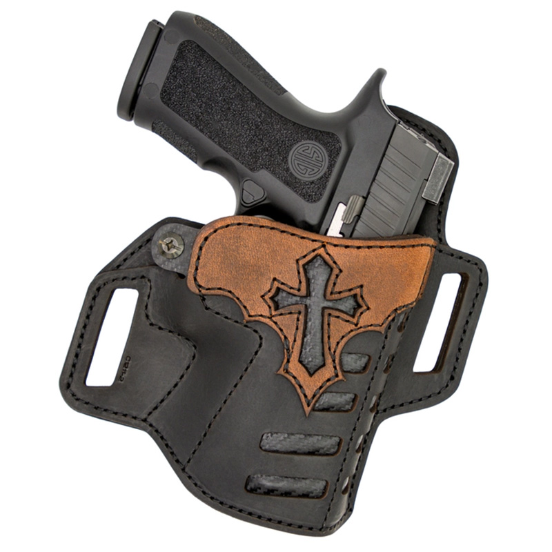 Handgun in black leather holster with cross design