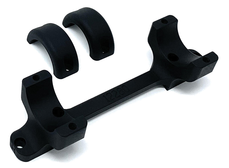 Black metal rifle scope mount with ring caps