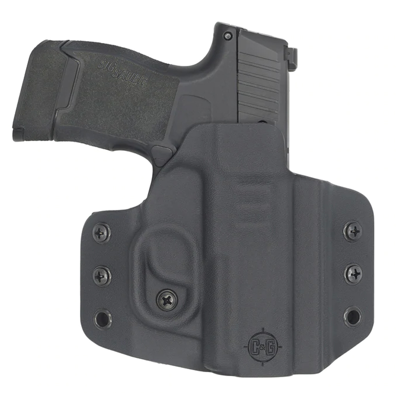 Black handgun in molded holster
