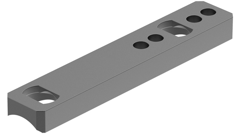 Machined metal bar with drilled holes and slots
