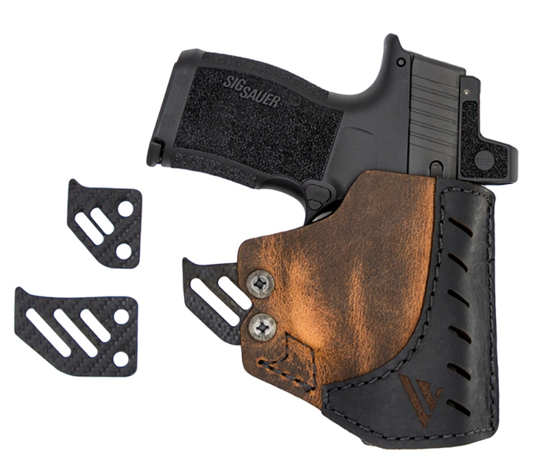 Sig Sauer pistol in leather holster with clips
