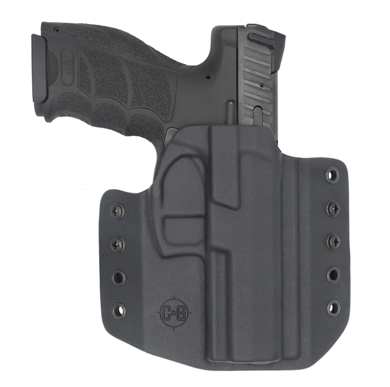 Black handgun in molded Kydex holster