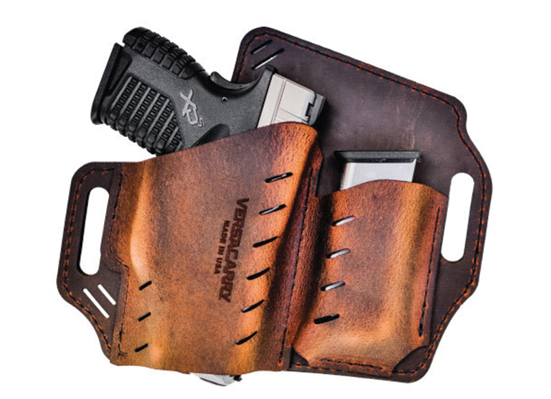 Handgun in brown leather holster with extra magazine